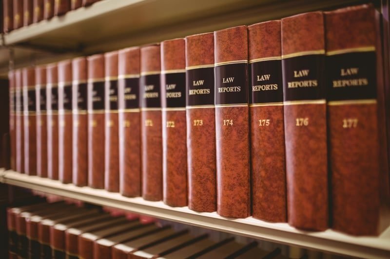 Construction Adjudication: A Complete UK Guide 2 Open law book representing the Construction Act 1996 and the Scheme