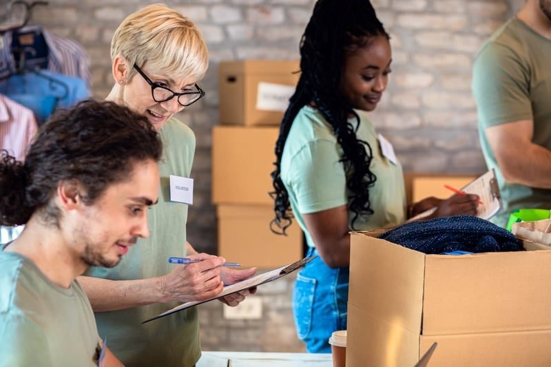 Charity volunteers sorting donations at a charity premises