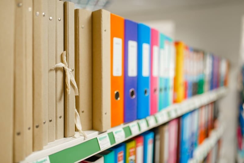 What Are Company Filings at Companies House? A Plain-English Guide for UK Businesses 2 Document folders representing the main annual filings at Companies House