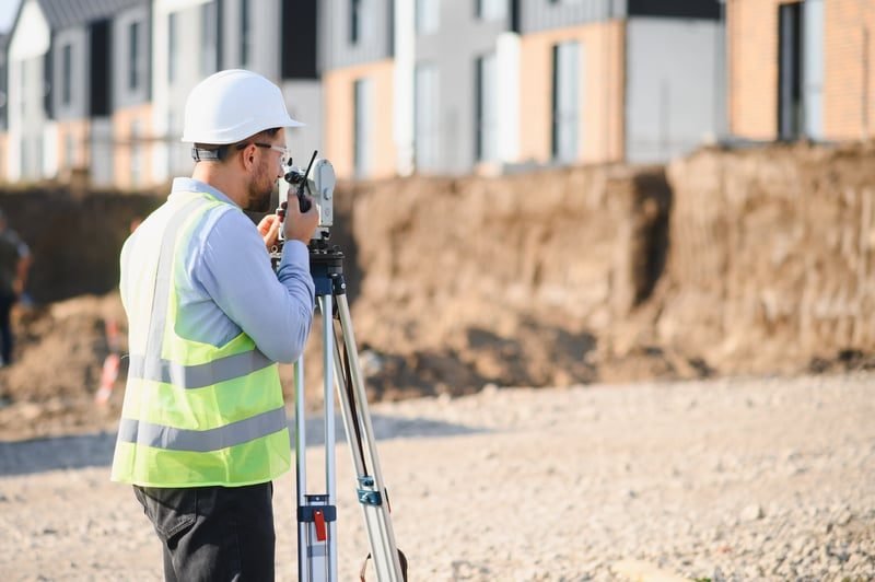 A quantity surveyor assessing the true value of construction works on site