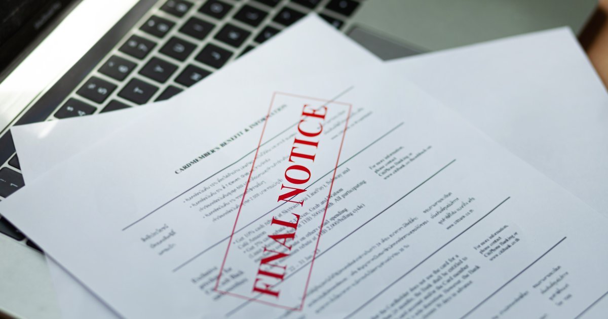 Document stamped 'Final Notice' resting on a laptop — construction payment disputes in the UK