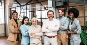 Insights 67 Diverse, inclusive team of professionals standing together in a modern office — UK discrimination claims and workplace equality