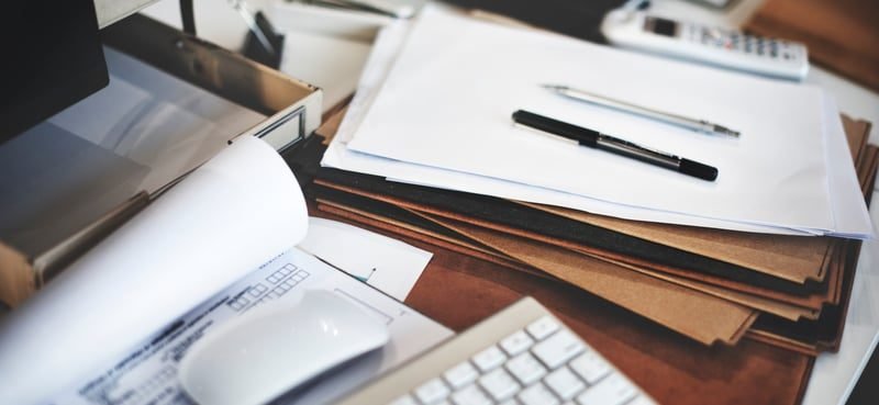 Employment Contracts: A Complete UK Guide 2 Written statement of employment terms and paperwork on a desk