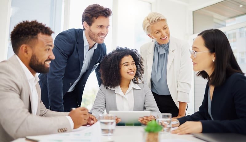 Employment Contracts: A Complete UK Guide 3 Colleagues working together in an office team meeting