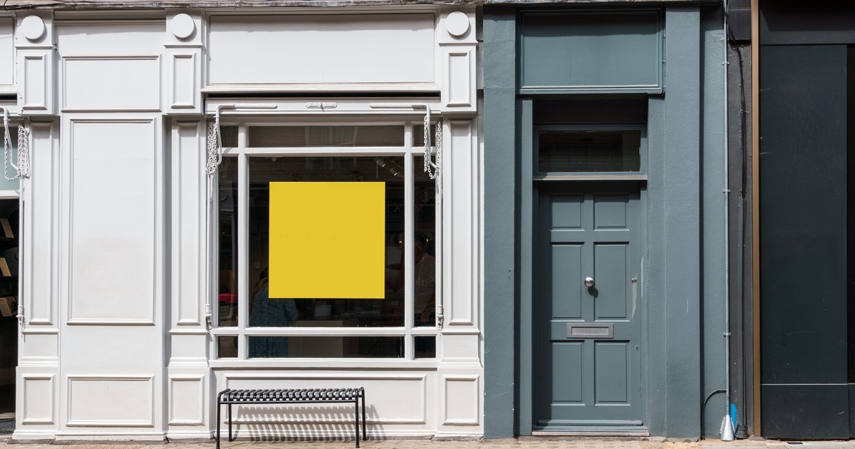 Vacant shopfront on a UK high street with an empty display window — empty property rates in the UK