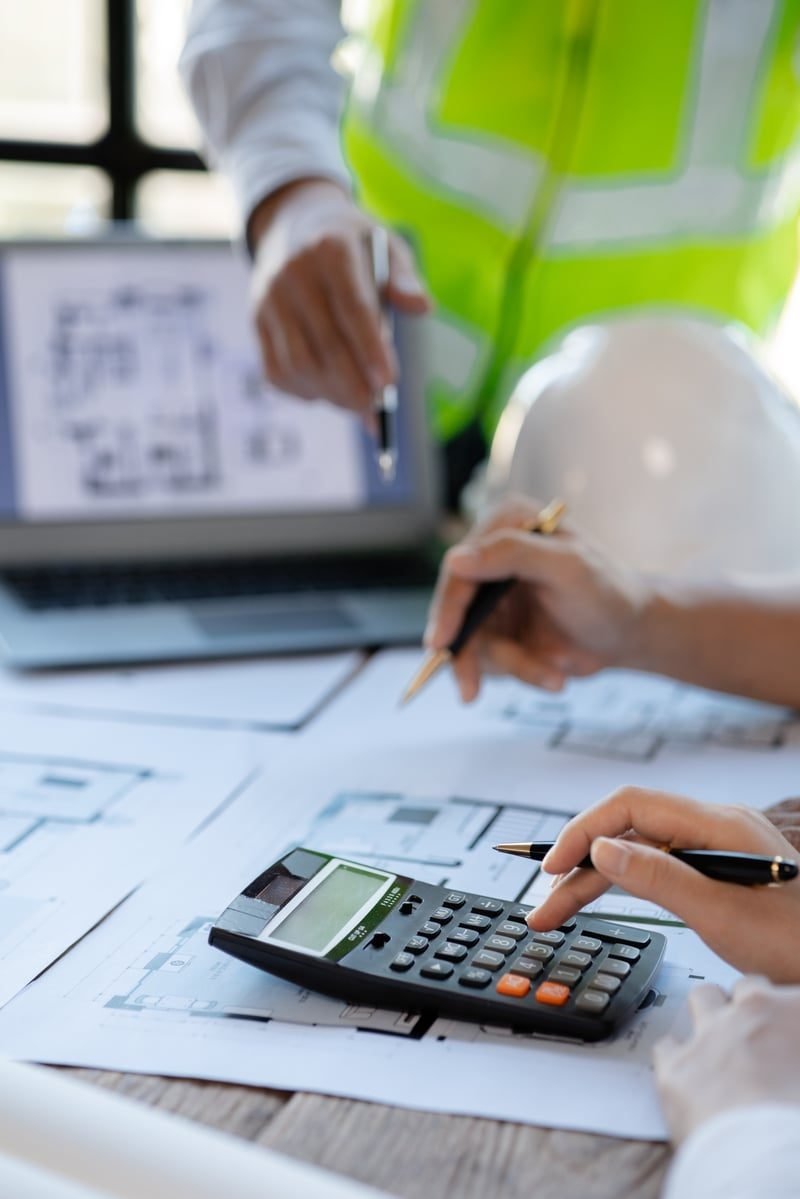 Final Account Disputes: A Complete UK Guide 1 Construction final account documents and calculator on a desk