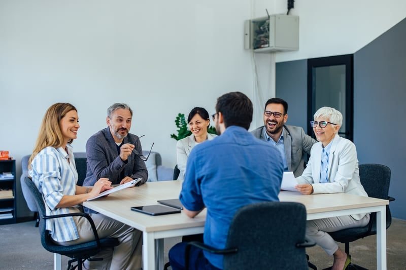 A formal grievance meeting with HR at a table