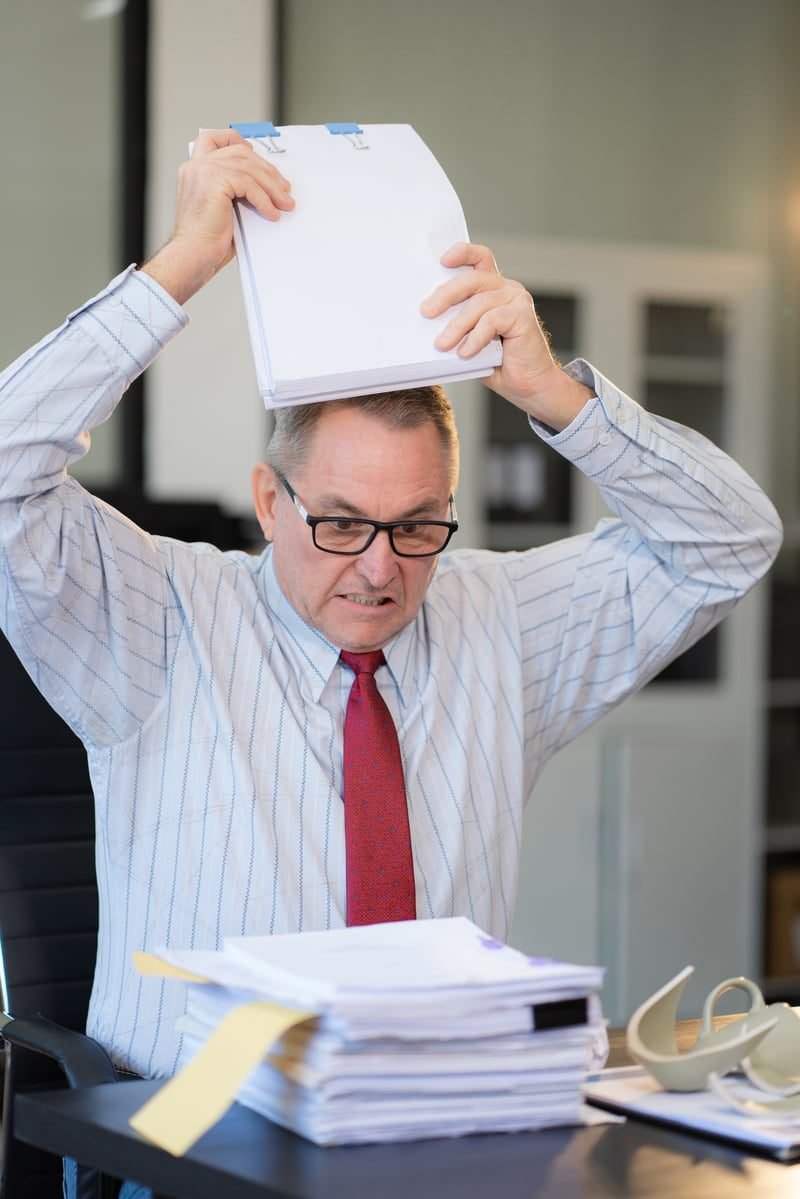 One-Way NDA vs Mutual NDA in London: What Local Businesses Need to Know 5 Frustrated business owner with paperwork after an NDA problem
