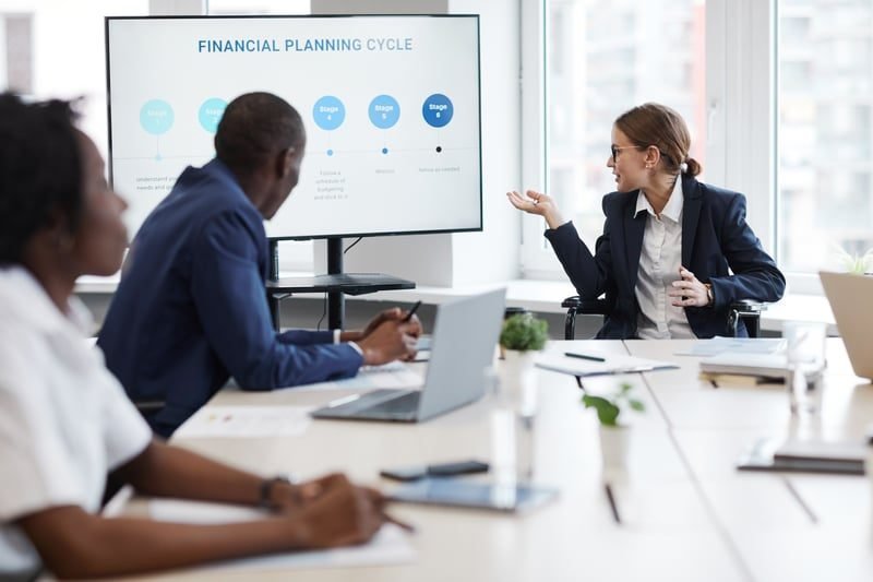 Business Rates for Offices: A Complete UK Guide 2 Office team in a financial meeting reviewing rates and budgets