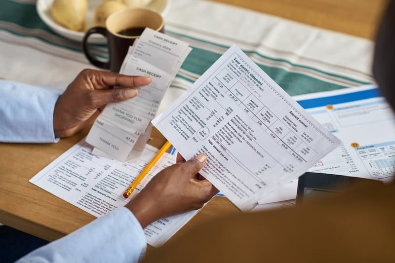 Business owner reviewing a rates bill and invoice