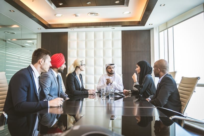 Strategic Property Reorganisation in London: What Local Businesses Need to Know 2 Company directors in a boardroom meeting discussing a group structure