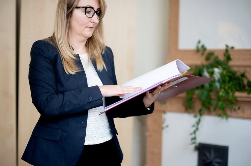 Strategic Property Reorganisation in London: What Local Businesses Need to Know 4 Solicitor reviewing legal documents during a property reorganisation