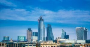 Insights 74 The City of London skyline with modern commercial towers under a blue sky — strategic property reorganisation in London