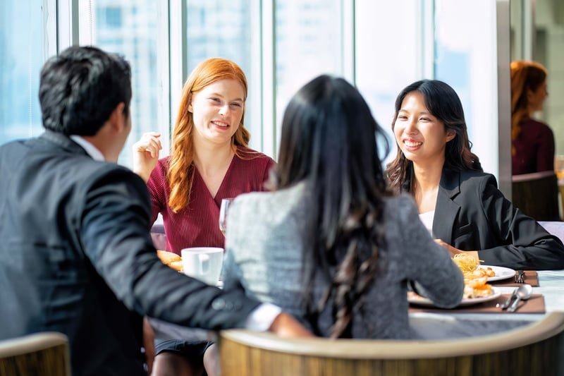 Tag-Along Rights in London: What Local Businesses Need to Know 3 Business parties negotiating shareholder terms around a table