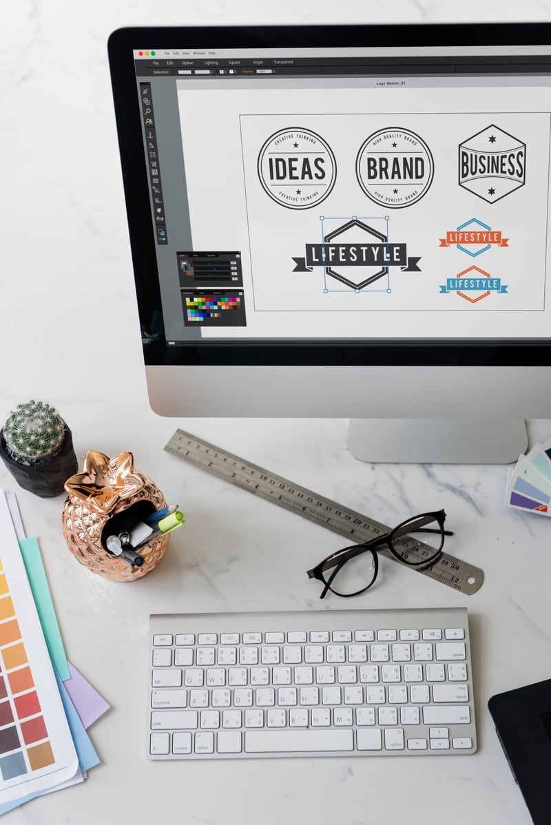 Designer working on brand logos, illustrating trade mark classes
