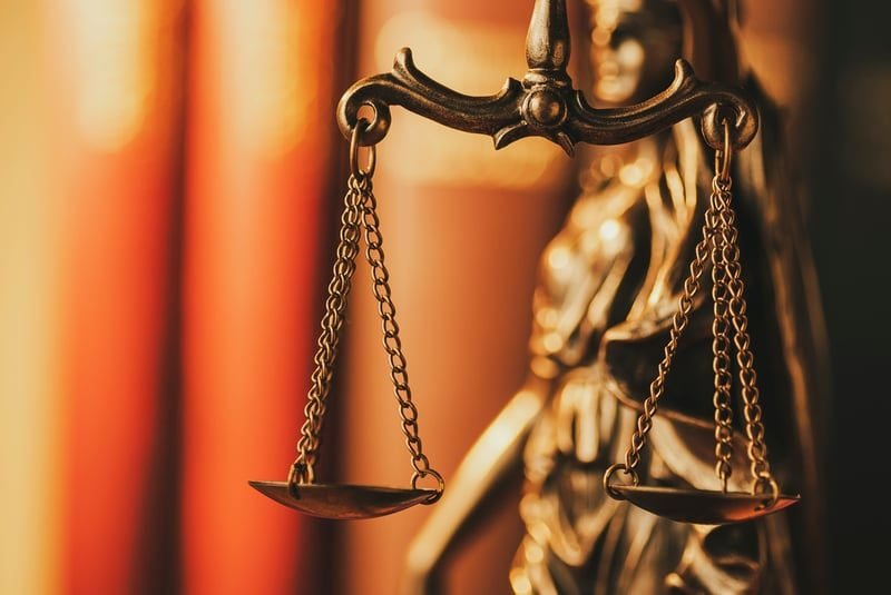 Unfair Dismissal: A Complete UK Guide 4 Scales of justice representing unfair dismissal remedies and compensation