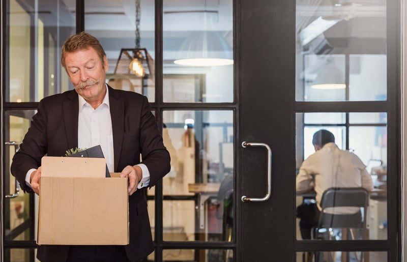 Unfair Dismissal: A Complete UK Guide 1 An employee leaving the office after dismissal