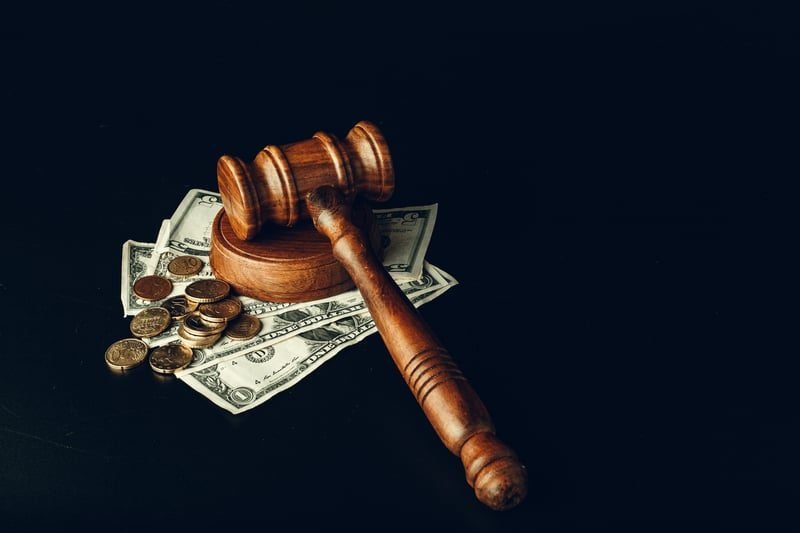 Without Prejudice Discussions: A Complete UK Guide 2 Gavel and money representing costs consequences of settlement offers